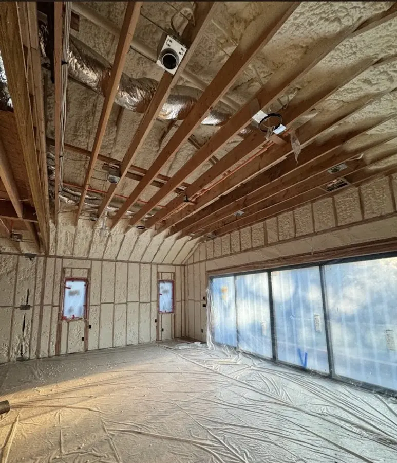 Interior walls and ceiling insulated with spray foam during new construction in St. John